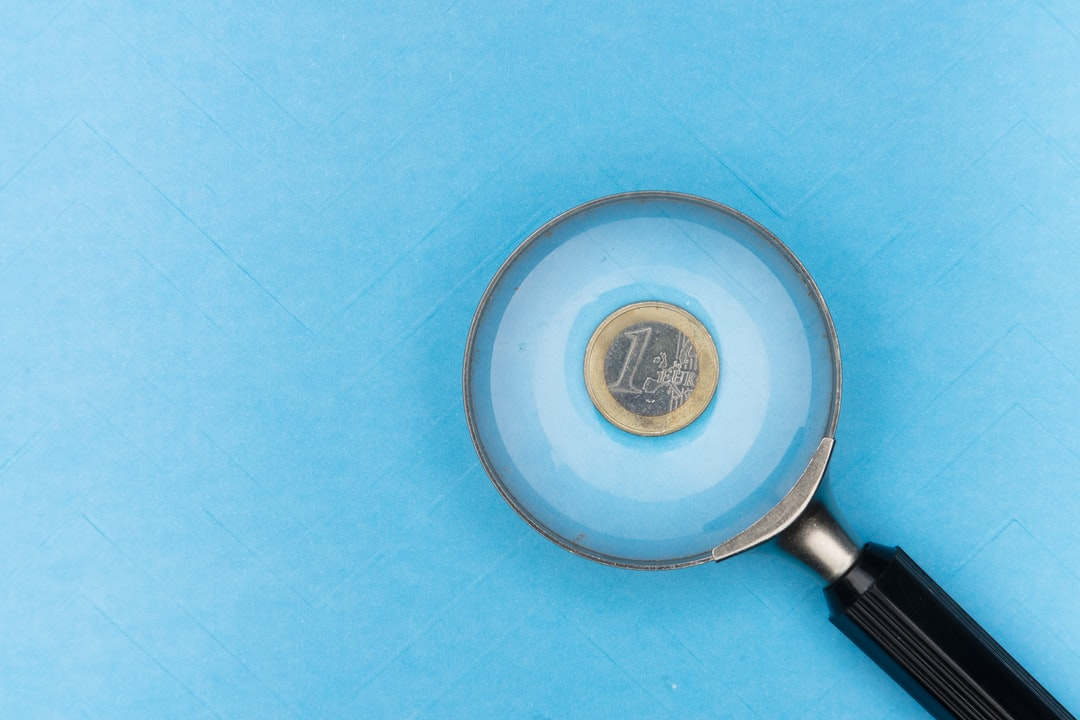 a euro coin under the magnifying glass
